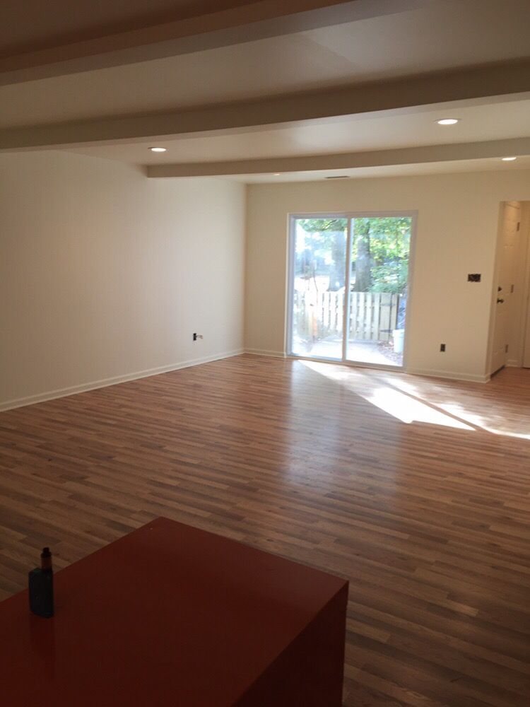 New-construction interior with bare sheetrock finished and painted in soft warm whites